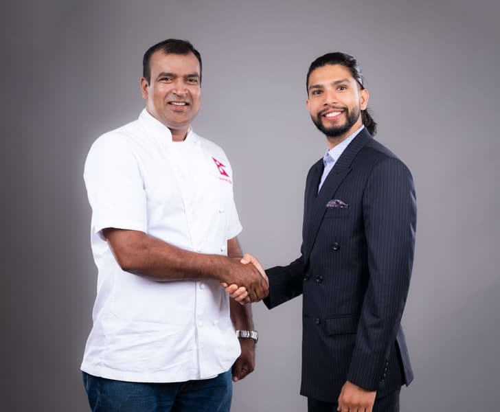 Samir shaking hands with Chef Santosh Shah